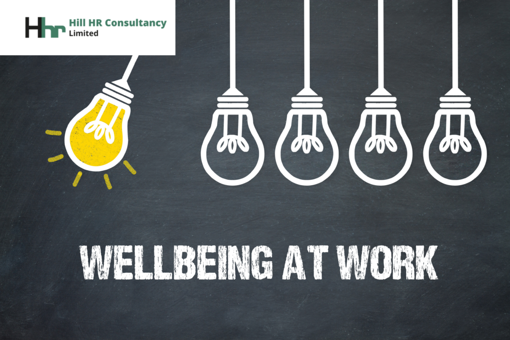 5 lightbulbs, one with a light on and wording wellbeing at work #hillhr